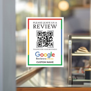 Peut inclure: Une pancarte blanche avec une bordure noire et un code QR. La pancarte indique "Veuillez nous laisser un avis" et "Merci pour votre entreprise !" avec un logo Google Avis et cinq étoiles. La pancarte indique également "NOM PERSONNALISÉ".