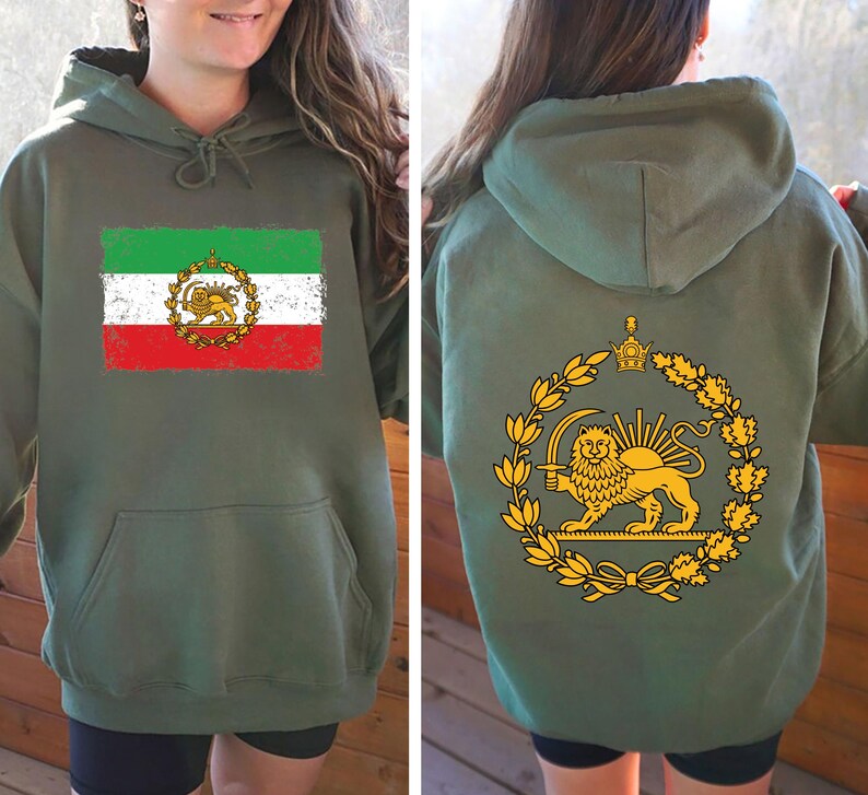 May include: Olive green hoodie featuring the Iranian flag on the front, with green, white, and red stripes and a golden emblem. The back displays a golden lion and sun emblem within a laurel wreath. The hoodie has a drawstring hood and a front pocket.