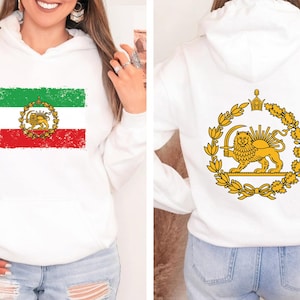May include: White hoodie featuring the Iranian flag on the front, with green, white, and red stripes and a lion emblem. The back displays a golden lion emblem within a wreath.
