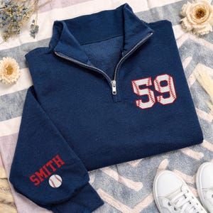 May include: A rustic wooden sign with the text "Welcome to our home" in white lettering. The sign features a distressed finish and a simple, inviting design, perfect for a front porch or entryway.