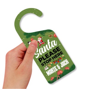 May include: Green door hanger with a Santa Claus illustration and the text "Santa Please Stop Here Marie & Jack".