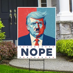 May include: A political yard sign featuring a red, white, and blue image of a man with a mustache and the word "NOPE" in large, bold, blue letters.