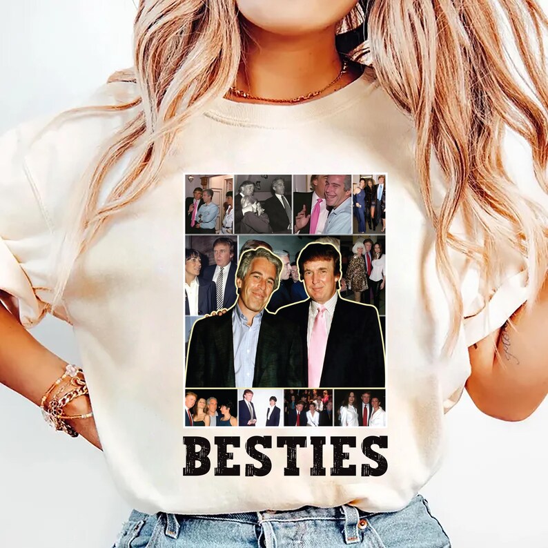 May include: Cream-colored t-shirt featuring a collage of images and the word "BESTIES" in bold, black letters. The collage includes multiple photos of two men in suits and ties. The shirt is made of a soft material.