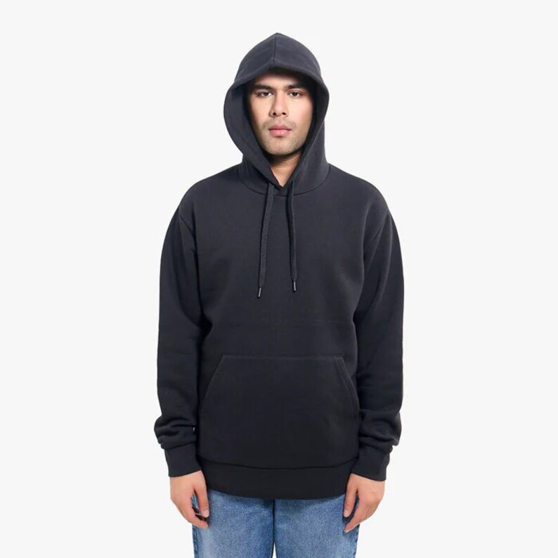 May include: A black hooded sweatshirt with a pouch pocket and a drawstring hood.