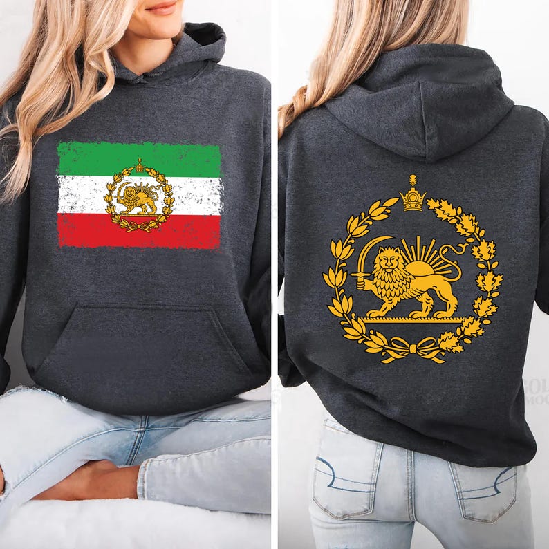 May include: Dark gray hoodie featuring the Iranian flag on the front and a golden lion emblem on the back. The flag design includes green, white, and red stripes with a lion and sun emblem. The back displays a golden lion holding a sword within a wreath.