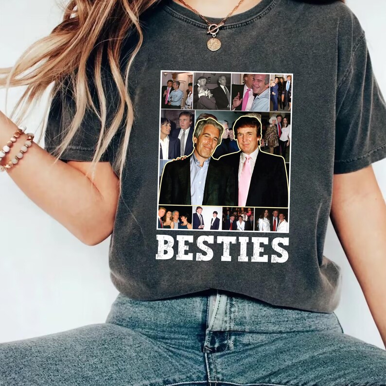 May include: Dark gray t-shirt featuring a collage of images and the word "BESTIES" in white. The collage includes photos of two men. The shirt is made of a soft material.