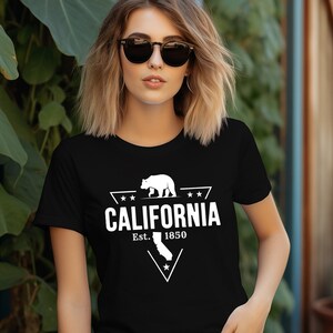 May include: Black t-shirt with a white graphic design featuring a California bear, a star, and the text "CALIFORNIA Est. 1850".