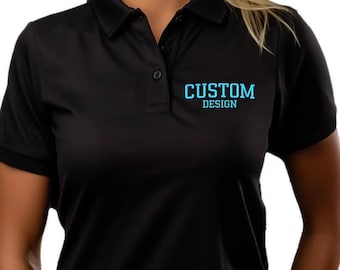 May include: A black short-sleeved polo shirt featuring a collar with a three-button placket. The text CUSTOM DESIGN is printed in light blue on the upper left chest area. The shirt is made of a smooth, solid-colored fabric with short sleeves.