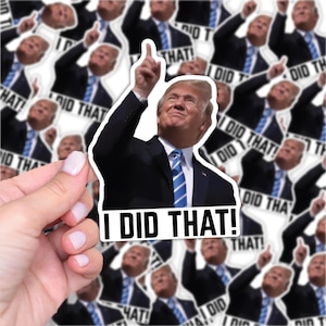 May include: A white sticker featuring a man in a black suit and blue tie pointing upwards. The sticker has the text "I DID THAT!" in bold, black letters. The background is filled with similar stickers.