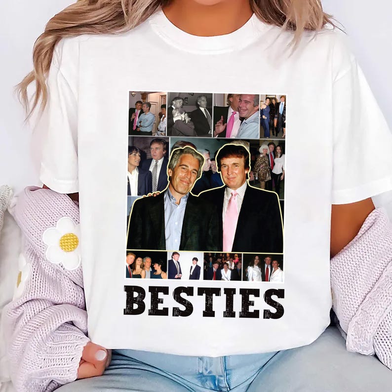May include: White t-shirt featuring a collage of photographs and the word "BESTIES" in black. The collage includes images of two men in suits, with a pink tie. The shirt is a casual style.
