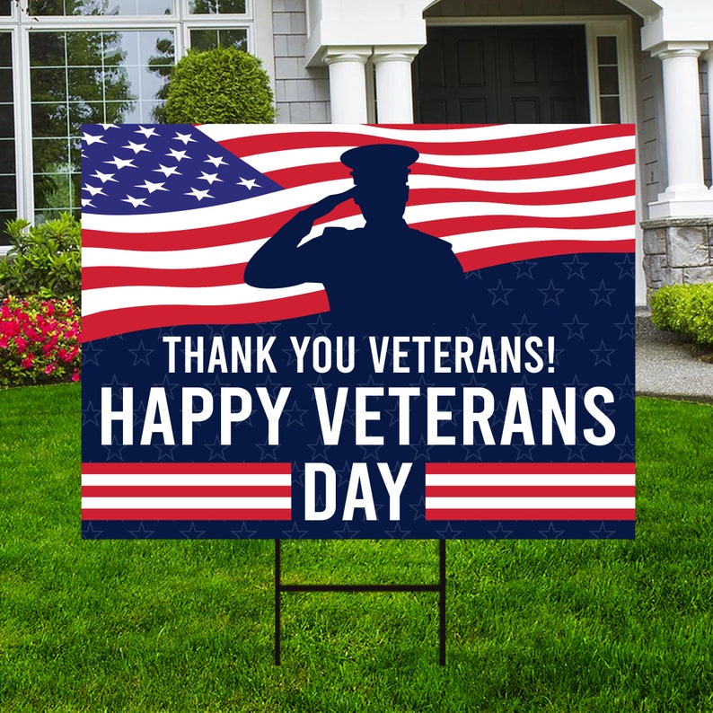 May include: A blue and red American flag with a silhouette of a person saluting. The text "Thank You Veterans! Happy Veterans Day" is printed on the flag.