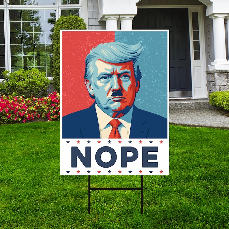 May include: A red, white, and blue yard sign with a picture of a man with a mustache and the word "NOPE" in large, bold, blue letters.