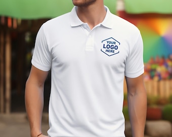 May include: A white short-sleeved polo shirt featuring a classic collar and a two-button placket. On the left chest, there is a dark blue hexagonal graphic containing the text YOUR LOGO HERE in a bold, sans-serif font.