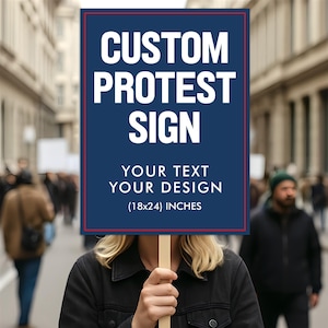May include: A custom protest sign with a navy blue background and white text that reads "CUSTOM PROTEST SIGN". The sign also includes the text "YOUR TEXT YOUR DESIGN" and the dimensions (18x24) inches. The sign is held by a person in a crowd.