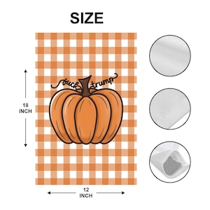 May include: Orange and white checkered pumpkin-themed decorative flag. The flag features a large orange pumpkin with the text "suck trump". The flag measures 18 inches by 12 inches.