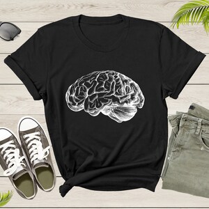 May include: Black t-shirt with a white graphic of a human brain.