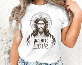 May include: White t-shirt featuring a sepia-toned illustration of Jesus wearing a crown of thorns, surrounded by a halo. The words "INFINITE LOVE" are printed below the image in a stylized font. The shirt has short sleeves.
