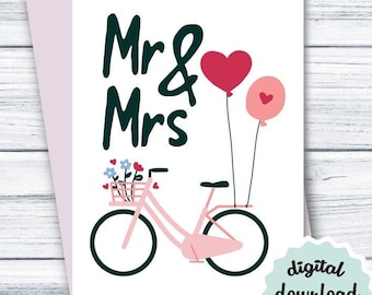 May include: A pink and white bicycle with a basket of flowers and two red heart balloons. The text "Mr & Mrs" is written in black above the bicycle. The image has a digital download label with the text "jpg + pdf".