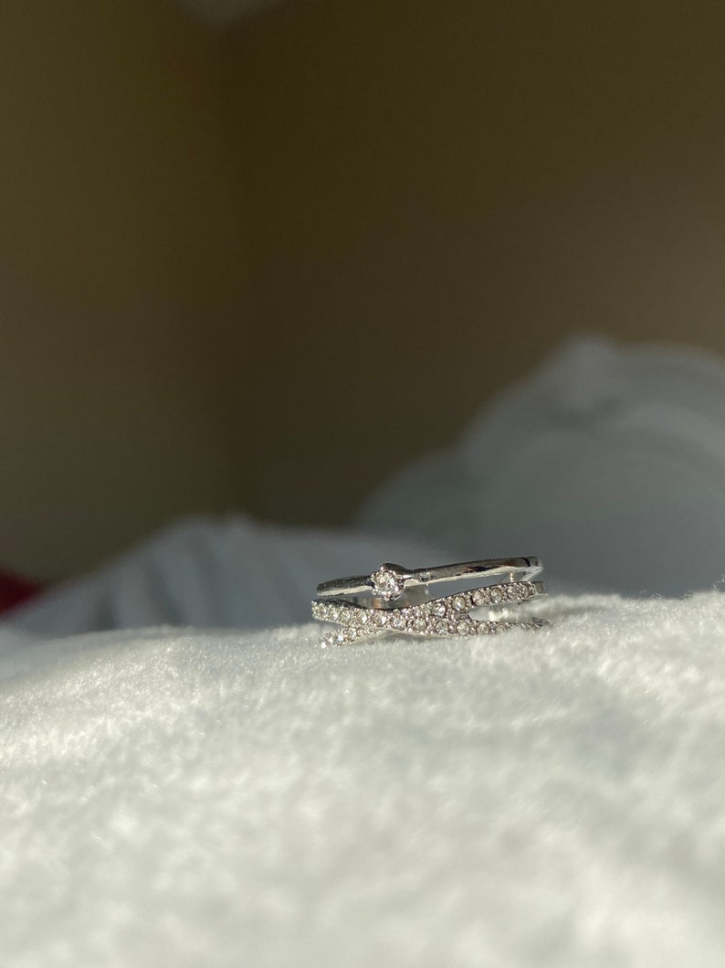 Double cross over silver ring