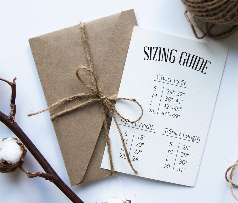May include: Sizing guide for t-shirts with measurements in inches for chest, width, and length.  The guide includes sizes S, M, L, and XL.