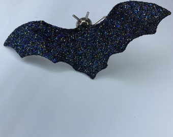 Spooky stainless steel black bat covered in glitter.