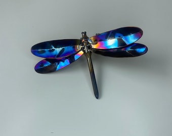 Stunning wall mounted , iridium coloured rainbow heat treated dragonfly.