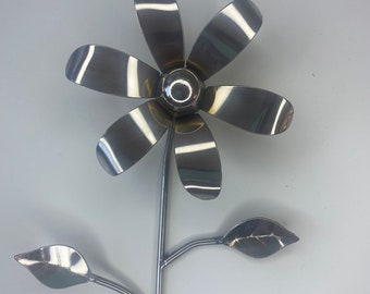 Stainless steel mirror polished shiny metal flower.