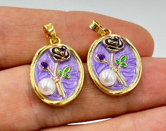 May include: Two gold-toned oval pendants with a floral design. Each pendant features a purple background with a black rose, a white pearl, and green leaves. The pendants are approximately 1 inch in length.