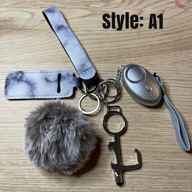Safety KeychainChapstick HolderAlarmFlashlightWomanGiftsGift ideasSafety GiftDoor OpenerPom PomStylusBottle Opener