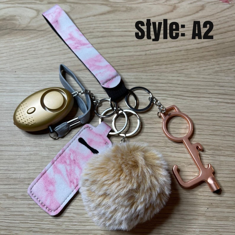 Safety KeychainChapstick HolderAlarmFlashlightWomanGiftsGift ideasSafety GiftDoor OpenerPom PomStylusBottle Opener