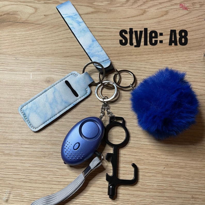 Safety KeychainChapstick HolderAlarmFlashlightWomanGiftsGift ideasSafety GiftDoor OpenerPom PomStylusBottle Opener