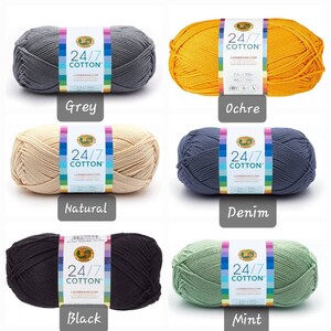 May include: Six skeins of Lion Brand 24/7 Cotton yarn in various colors: grey, ochre, natural, denim, black, and mint.