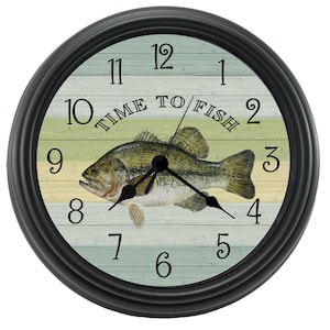 May include: Black clock with a white and green striped background. A largemouth bass fish is in the center of the clock face. The clock face reads "Time to Fish".