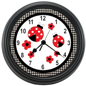 May include: Black and white checkered clock with a white face. The clock features red ladybugs with black dots and red flowers. The numbers 1 through 12 are printed on the clock face.