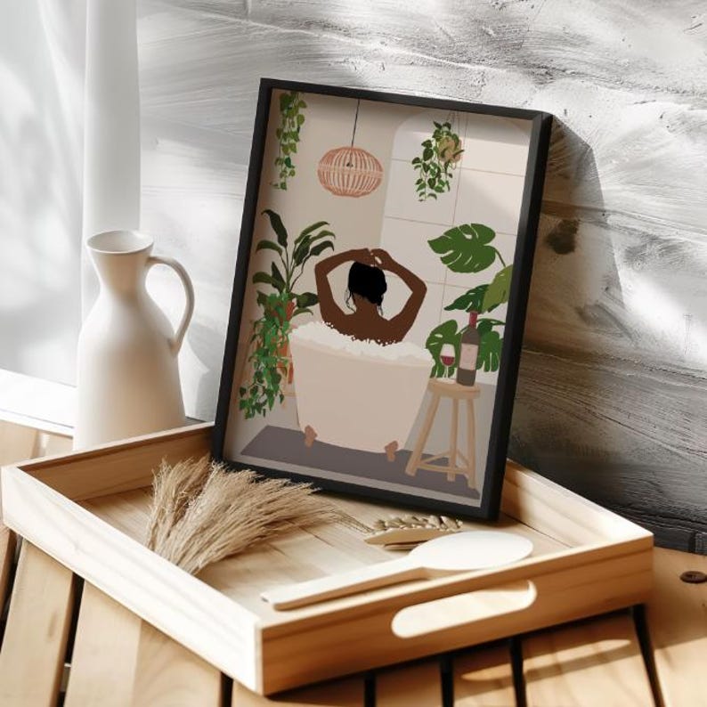 May include: A framed illustration of a person relaxing in a bathtub with a glass of wine and plants in the background.