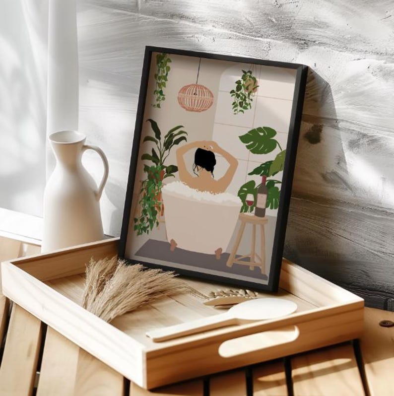 May include: A framed illustration of a person relaxing in a bathtub surrounded by plants. The person is facing away from the viewer and has their arms raised above their head. A glass of wine is on a small wooden stool next to the bathtub.