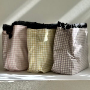 Pastel check medium drawstring toiletry/wash bag with waterproof lining