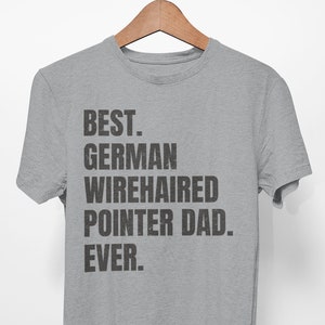 May include: A gray t-shirt with the text "BEST. GERMAN WIREHAIRED POINTER DAD. EVER." printed in black.