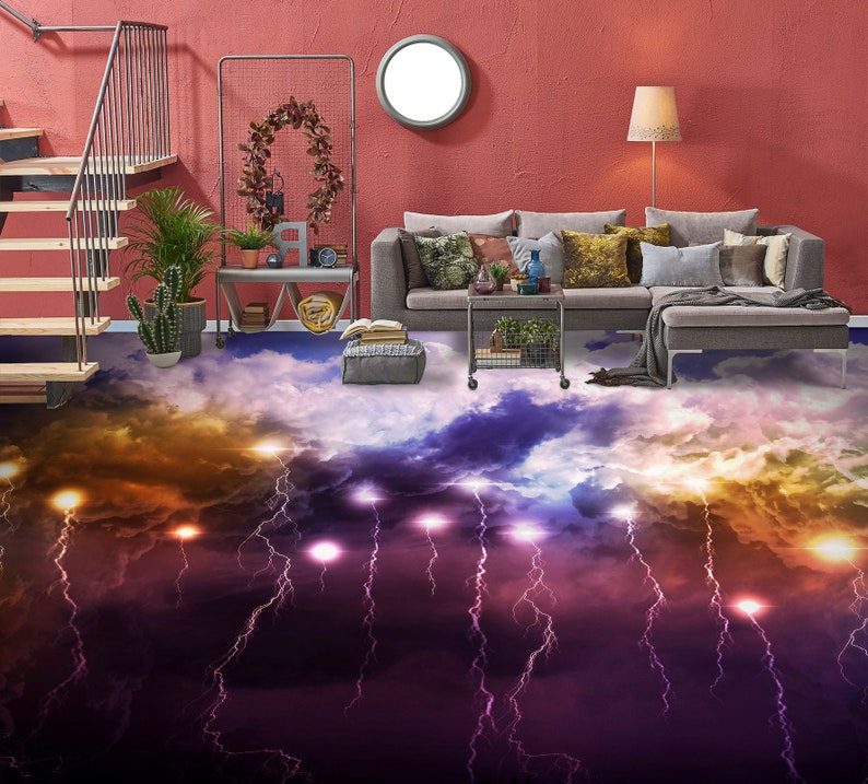 May include: A living room with a sectional sofa and a cloud-like floor with lightning bolts. The floor is a 3D printed design with a purple, blue, and yellow color scheme. The sofa is gray and has pillows in various colors. The room has a red wall and a window with a white circle in the middle. There is a lamp on the right side of the image.