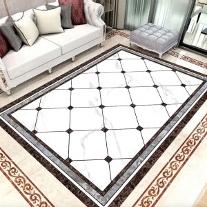 May include: A white and brown patterned area rug with a black and white checkered design. The rug has a brown border with a silver accent.