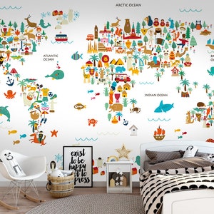 May include: A colorful world map wall mural with illustrations of animals, landmarks, and ocean creatures. The map includes the text "PACIFIC OCEAN", "ATLANTIC OCEAN", "ARCTIC OCEAN", and "INDIAN OCEAN". A white rocking chair, a basket, and a bed are in the foreground.