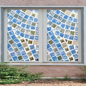 May include: A window with a mosaic of blue and green tiles. The tiles are arranged in a random pattern, creating a unique and eye-catching design.