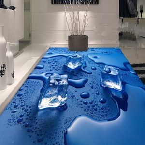 May include: A blue floor with a 3D effect of ice cubes melting and water droplets. The floor is a realistic depiction of a wet surface.