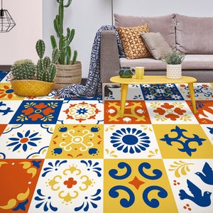 May include: A colorful patterned tile floor with a mix of blue, yellow, red, and white geometric designs. The floor is made up of individual square tiles that are arranged in a repeating pattern.
