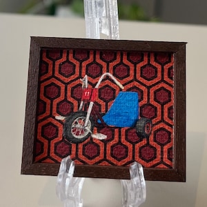 The Shining Miniature Canvas Print: Danny&#39;s Big Wheel, Overlook Hotel Carpet