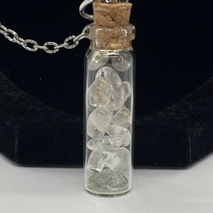 silver curb link chain phantom crystal in a glass bottle necklace