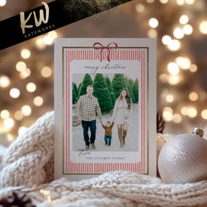 May include: Christmas card with a family photo inside a red and white striped border. The card has a red bow at the top and the words "merry christmas" and "love" in script. The family name is "THE LINAMEN FAMILY".