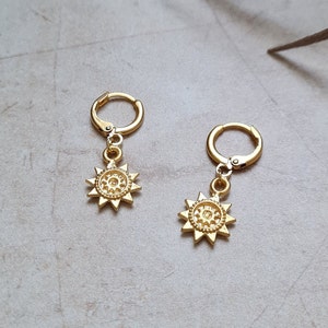 pair of 14k gold plated sun charm huggie hoop earrings | dainty minimalist tiny wheel hoop earrings