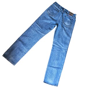 May include: A pair of blue denim jeans with a faded look. The jeans have a straight leg and a classic five-pocket design.