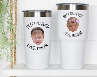 May include: Two white stainless steel tumblers with black text that reads "Best Dad Ever" and a photo of a child. The text below the photo reads "Love, [child's name]"